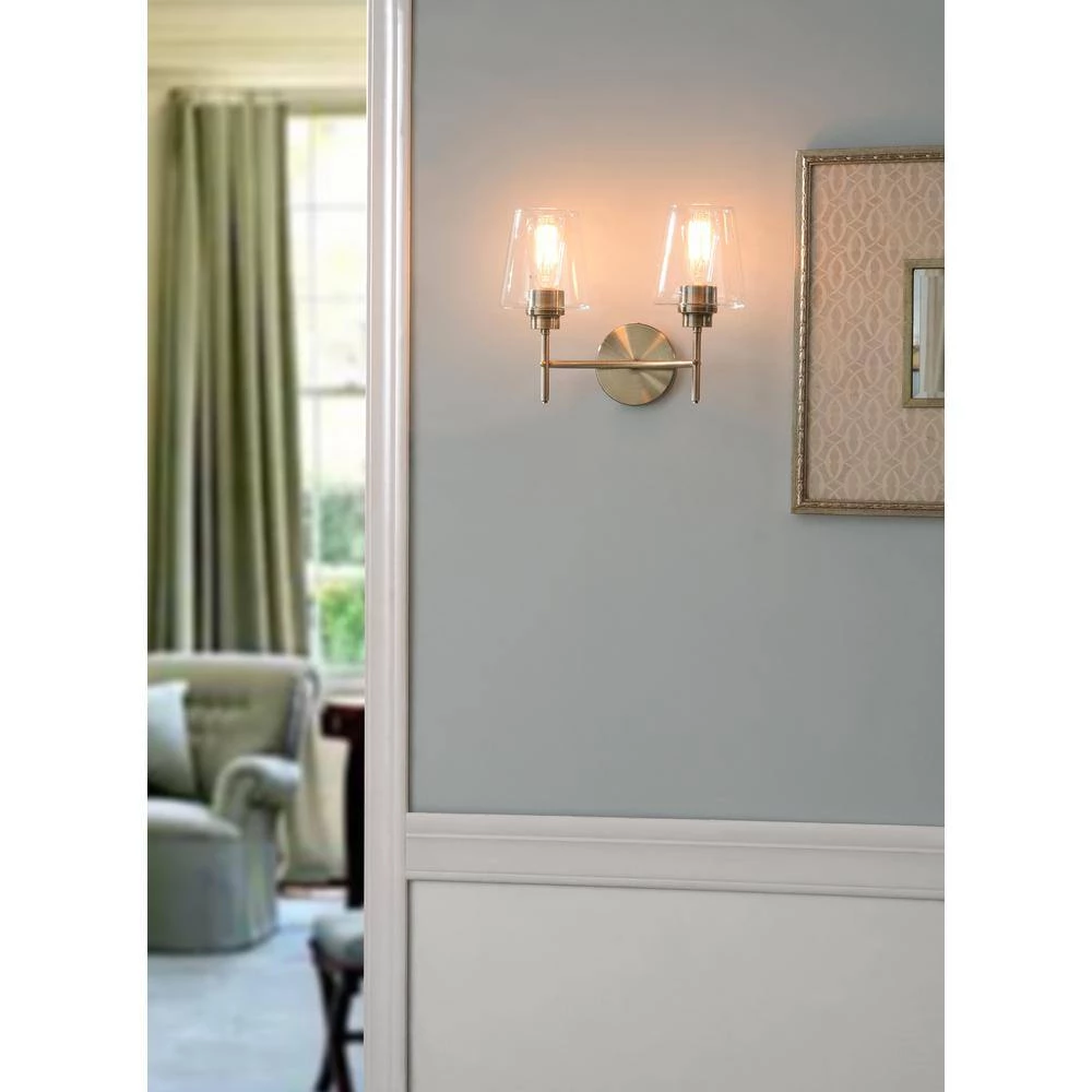 Martin 14 in. 2-Light Antique Brass Vanity Light with Clear Glass Shades by Manor Brook 4 Martin 14 in. 2-Light Antique Brass Vanity Light with Clear Glass Shades by Manor Brook - Image 3