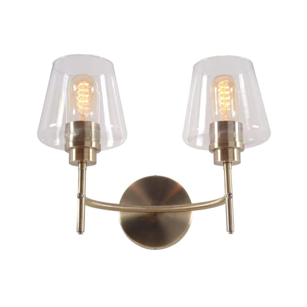 Martin 14 in. 2-Light Antique Brass Vanity Light with Clear Glass Shades by Manor Brook 2 Martin 14 in. 2-Light Antique Brass Vanity Light with Clear Glass Shades by Manor Brook
