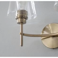 Martin 14 in. 2-Light Antique Brass Vanity Light with Clear Glass Shades by Manor Brook 14 Martin 14 in. 2-Light Antique Brass Vanity Light with Clear Glass Shades by Manor Brook -Brightech Sales antique brass manor brook vanity lighting mb100164 76 1000