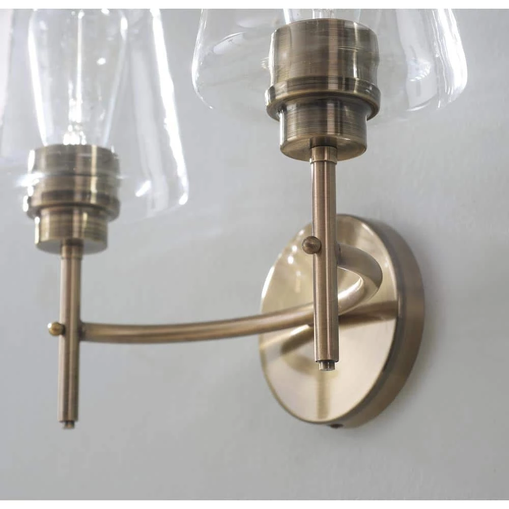Martin 14 in. 2-Light Antique Brass Vanity Light with Clear Glass Shades by Manor Brook 7 Martin 14 in. 2-Light Antique Brass Vanity Light with Clear Glass Shades by Manor Brook - Image 6