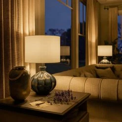 Cona 22 in. Reactive Blue Ceramic Glaze with Black Table Lamp with White Drum Shade by Manor Brook 13 Cona 22 in. Reactive Blue Ceramic Glaze with Black Table Lamp with White Drum Shade by Manor Brook -Brightech Sales reactive blue ceramic glaze with black manor brook table lamps mb100013 1f 1000