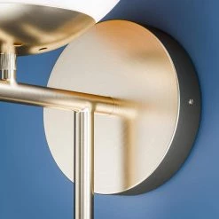 Adella 1-Light White with Antique Brass Wallchiere by Manor Brook -Brightech Sales white with antique brass manor brook wall sconces mb100609 fa 1000